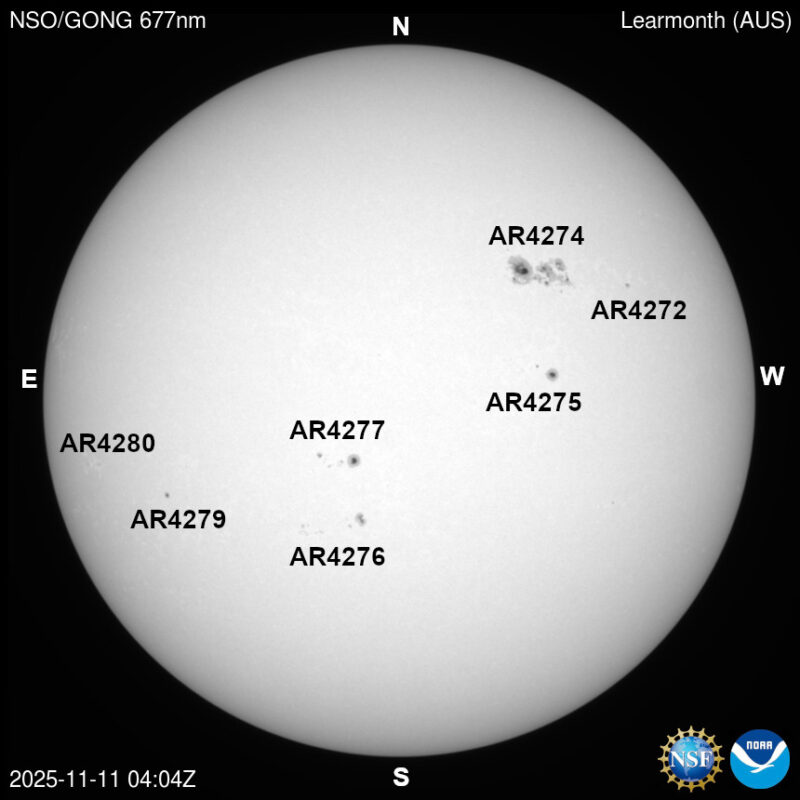 The sun, seen as a large white sphere with dark spots, each labeled.