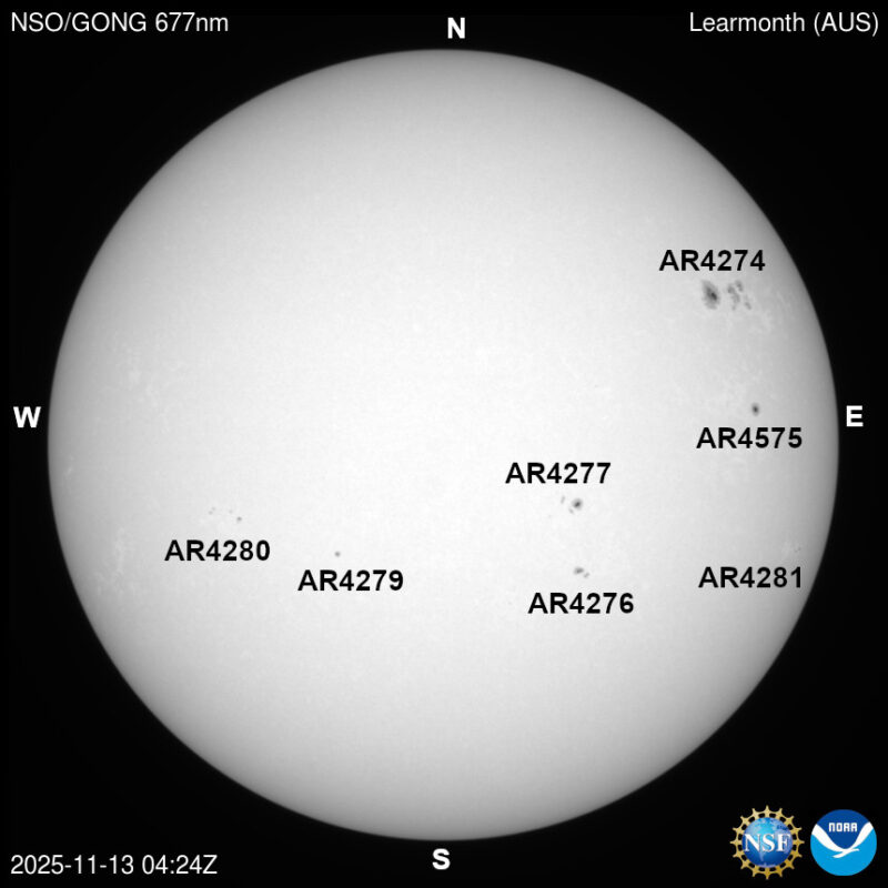 The sun, seen as a large white sphere with dark spots, each labeled.