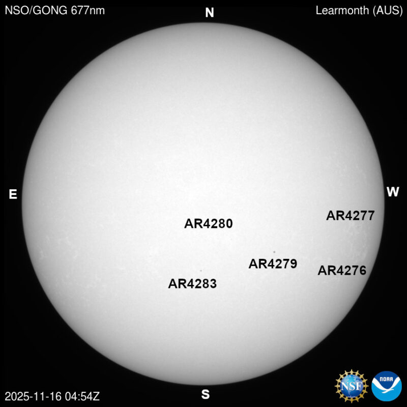 The sun, seen as a large white sphere with dark spots, each labeled.