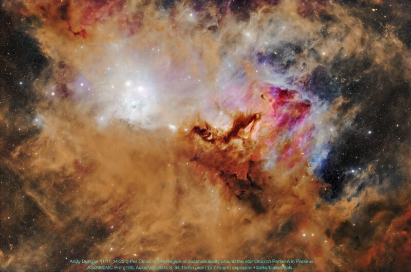 An expansive area of complex orange nebulosity with overlaid dark patches and numerous immersed stars.