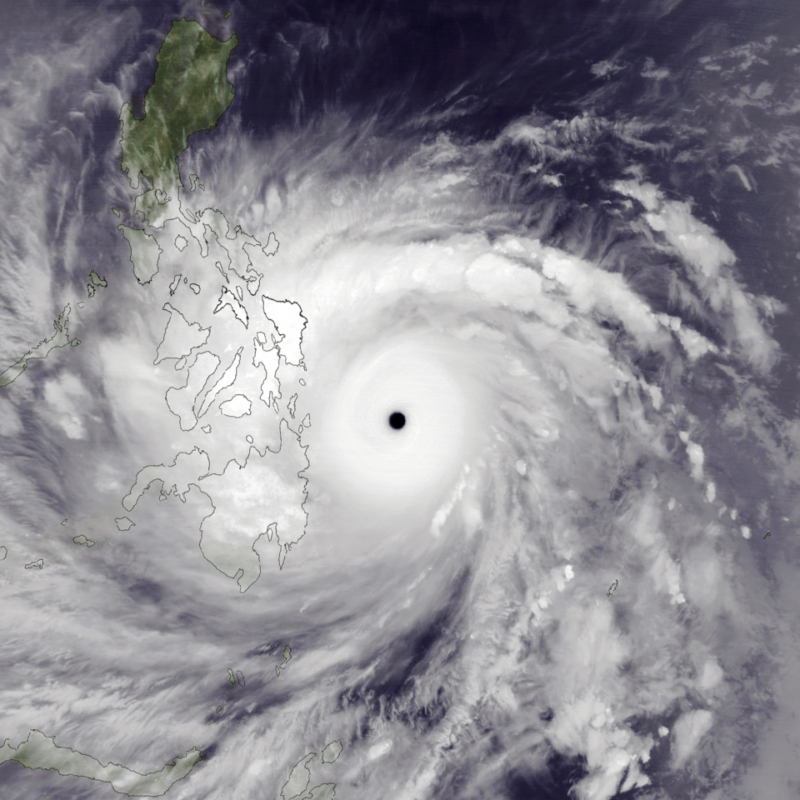 Category 6 storms: Satellite view of a huge white spiral with a black dot inthe middle with an outline of islands on part of it.