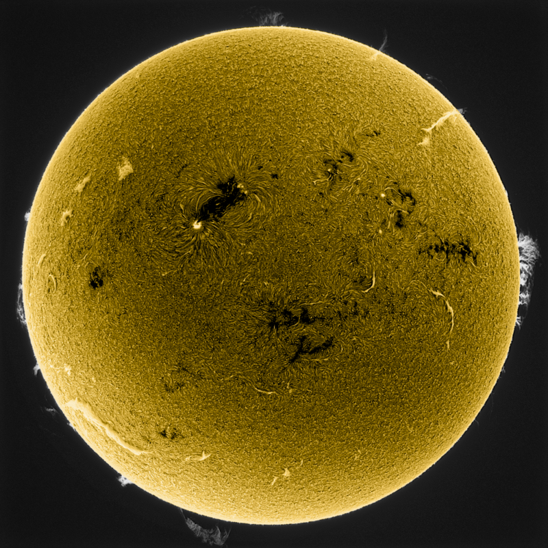 The sun, seen as a large yellow sphere with a mottled surface.