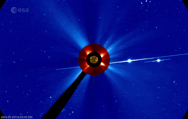 Moving image of a masked sun with a large amount of material blasting outward.