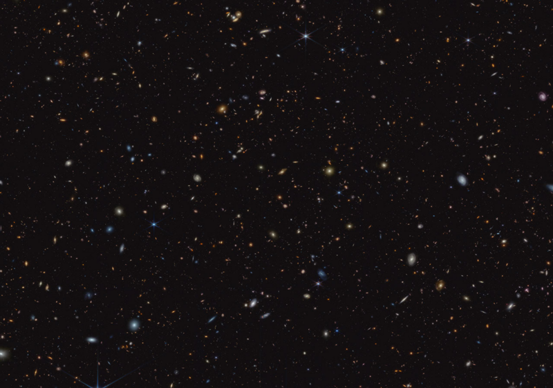 An array of multitudinous distant galaxies of all shapes, appearing very tiny.
