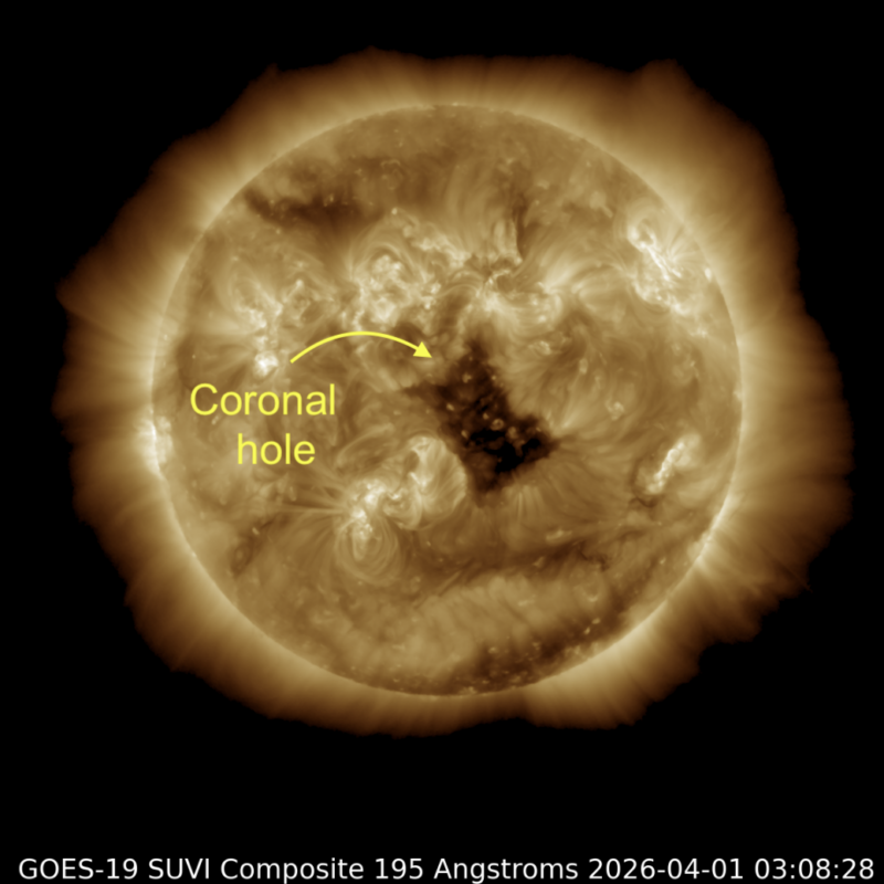 The sun as a mottled gold ball with a big, irregular dark area roughly in the middle.