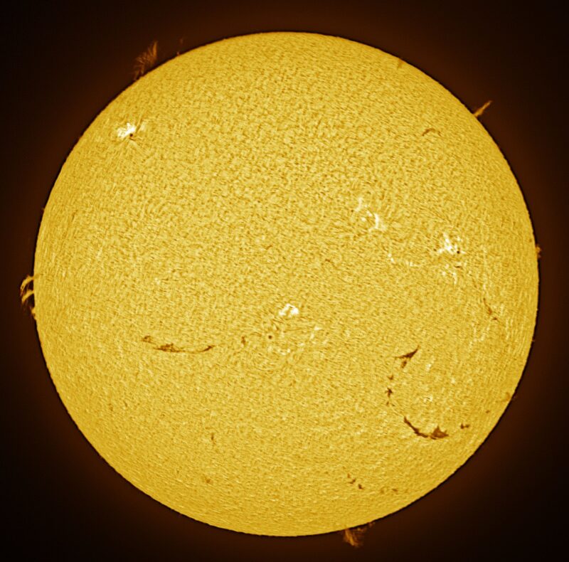 The sun, seen as a large yellow sphere with a mottled surface.