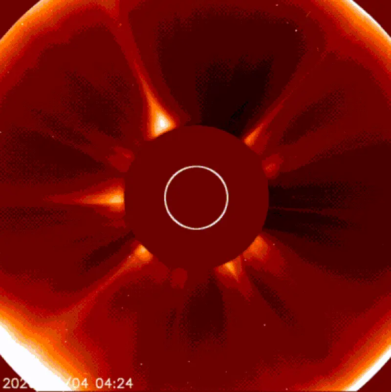 Sun blotted out by occulting disk. Comet enters from lower left, plunges into sun and appears to disintegrate.