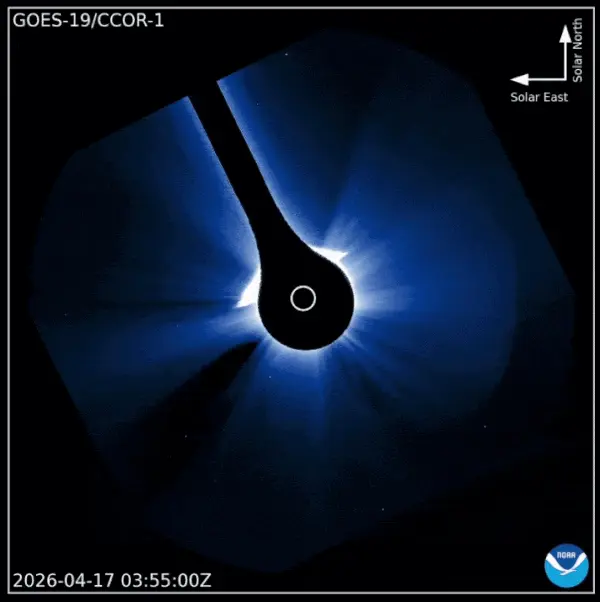 Space view of blocked-out sun with the moon traveling across the field of view.