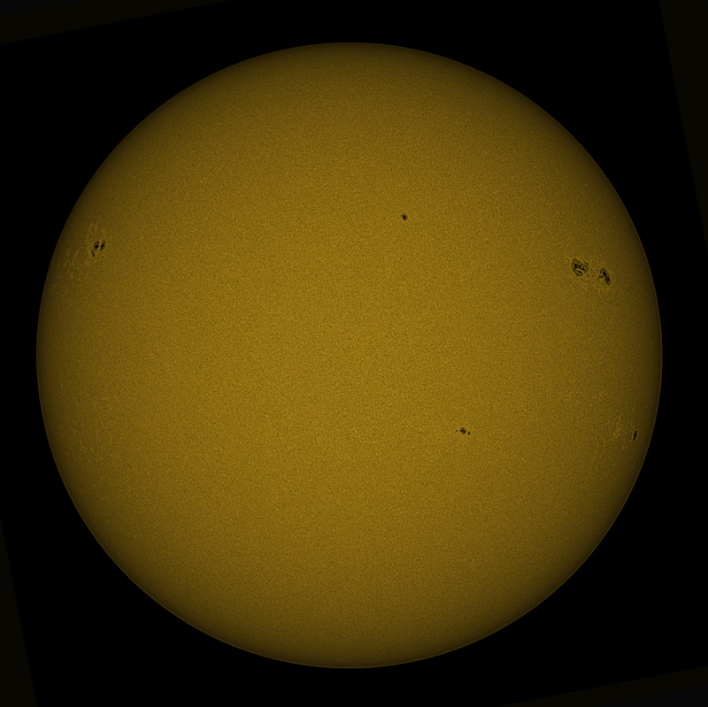 The sun, seen as a large yellow sphere with a mottled surface.