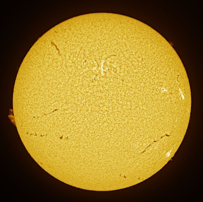 The sun, seen as a large yellow sphere with a mottled surface.