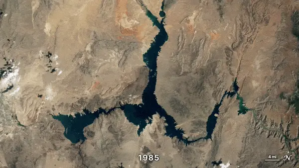 Animation, orbital view of irregular shaped long lake getting skinnier.