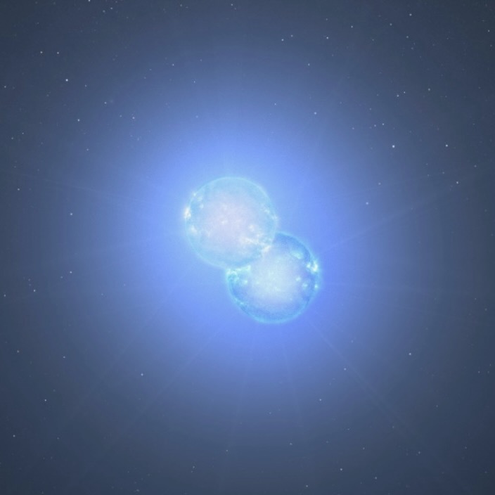 Two glowing balls near each other and surrounded by an aura of light.