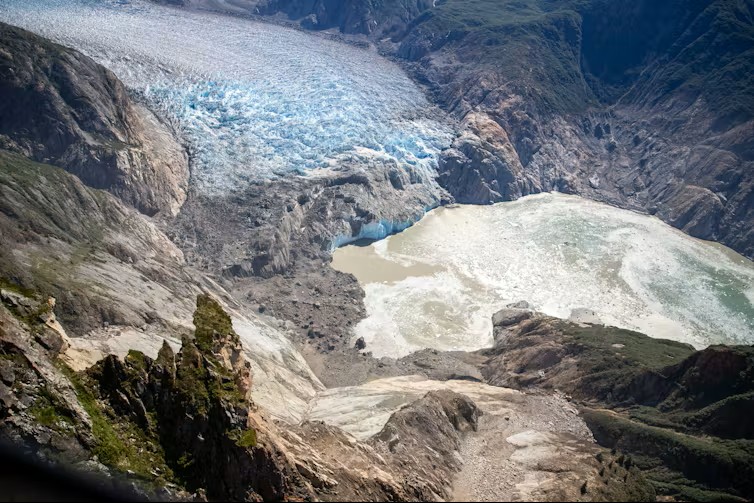 2025 Alaska megatsunami: View looking down at a glacier and where it enters into water.
