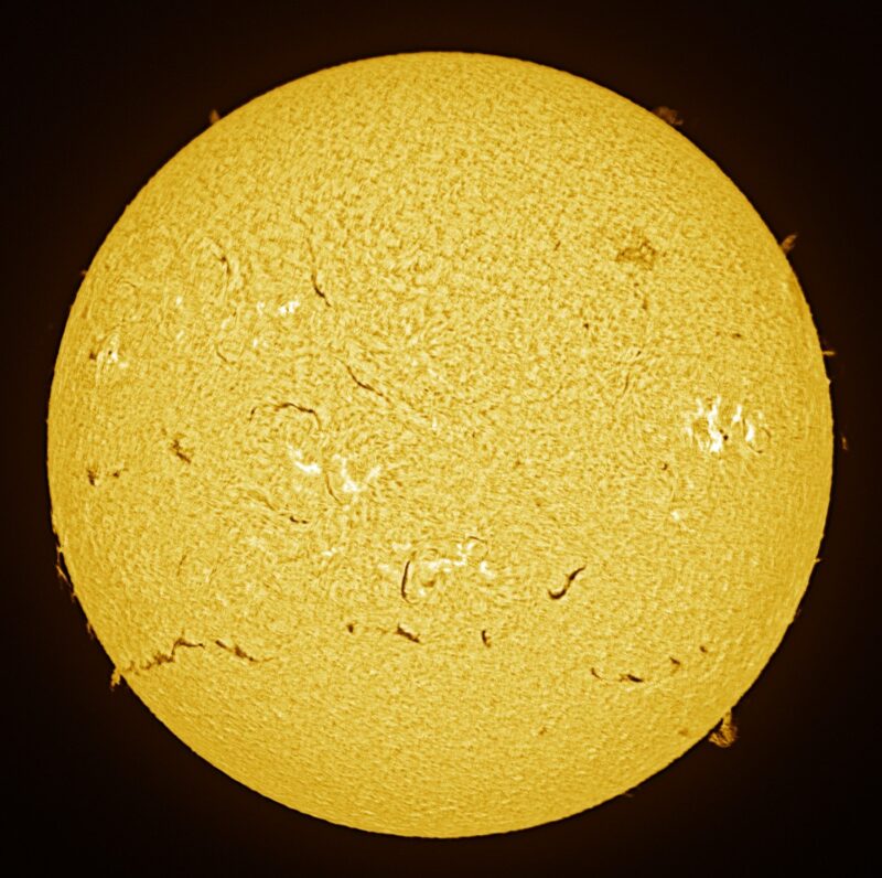 The sun, seen as a large yellow sphere with a mottled surface.