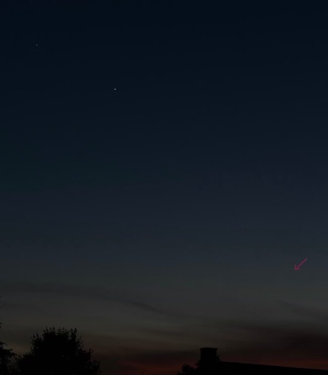 2 bright dots in the sky and 1 fainter dot closer to the horizon.