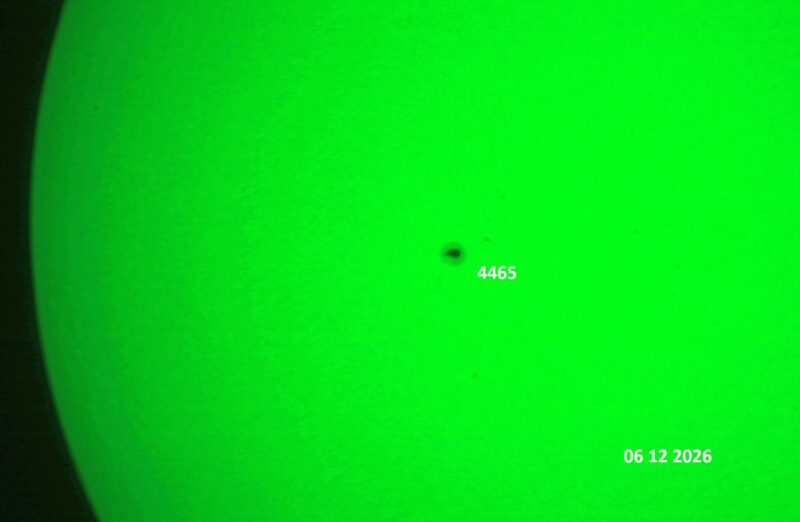 The sun, seen as a green sectional sphere with dark spots, each labeled.