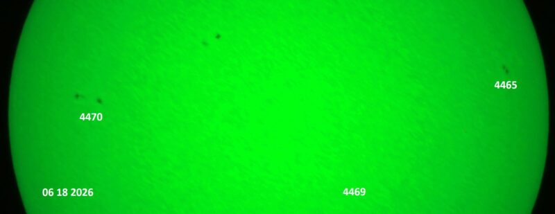 The sun, seen as a green sectional sphere with dark spots, each labeled.