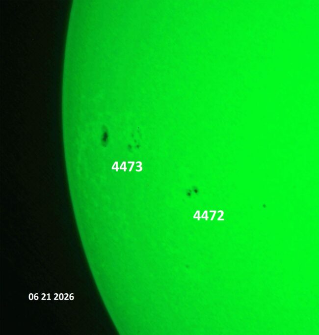 The sun, seen as a green sectional sphere with dark spots, each labeled.