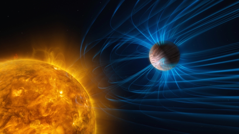 Artist's illustration of fiery orange sun in lower left and Jupiter-like planet in upper right, swirling with vivid blue magnetic fields.