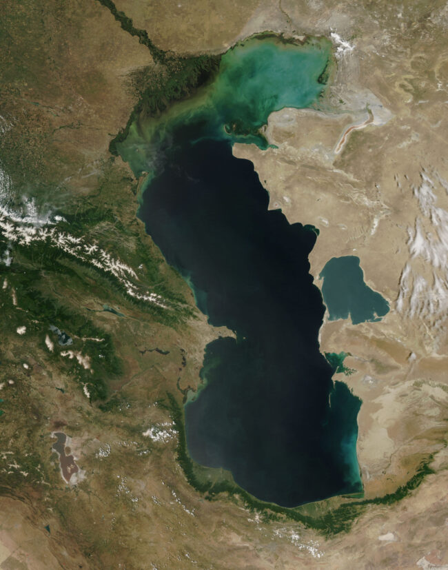 Caspian Sea: Satellite view of an oblong dark blue lake with a lighter blue area at the top.