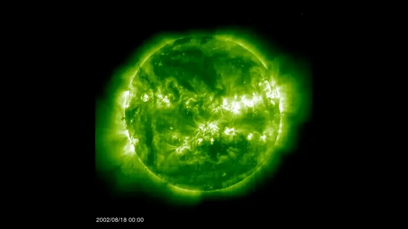 Green sphere with very bright areas together, creating 2 horizontal lines in its surface.