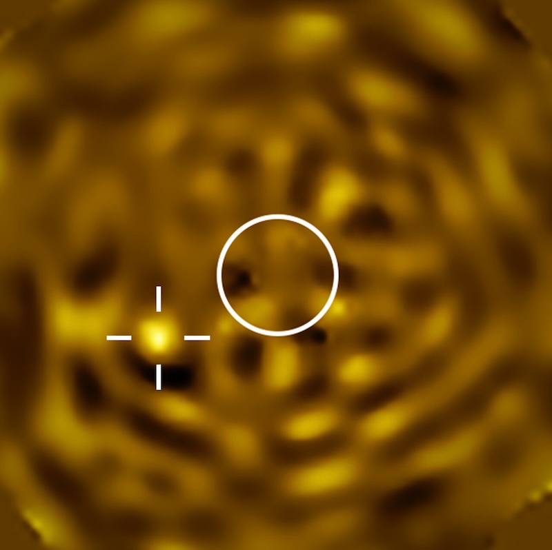 Zoomed in view with a white circle in the middle where Betelgeuse would be and a highlighted bright spot to its lower left that is most likely the companion star to Betelgeuse.
