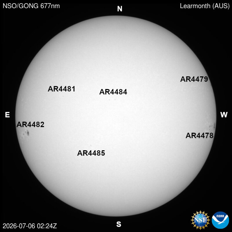 The sun, seen as a large white sphere with dark spots, each labeled.