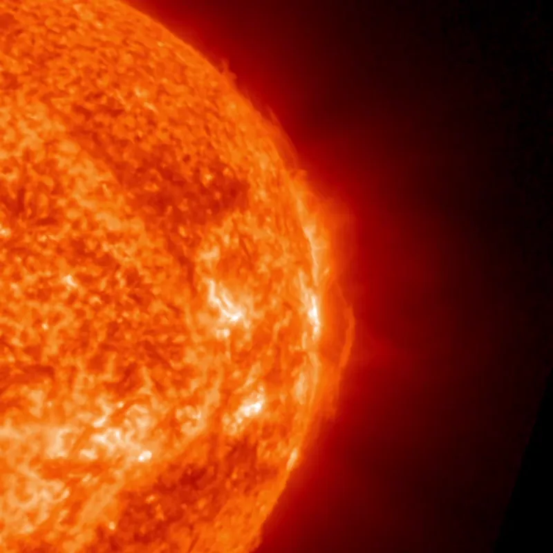A vast streamer of glowing gas erupting from the side of the sun.