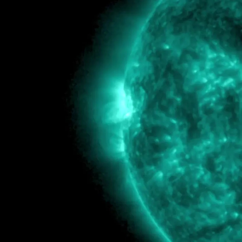 Animation of the solar face with a bright flash near the horizon.