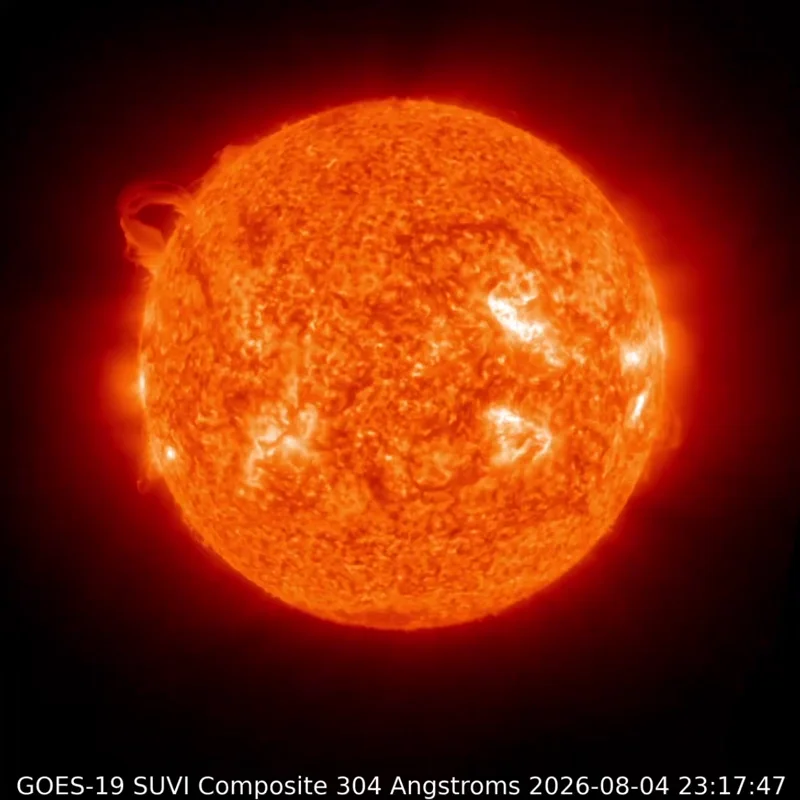 The face of the sun, with a glowing loop expanding off one edge and dissipating into space.