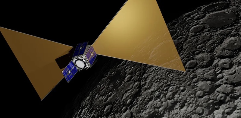 Small boxy satellite above the moon, with 2 big, golden triangular solar panels.