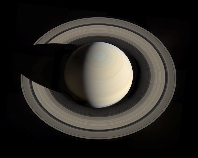 In October 2013, Cassini flew high above Saturn, looking down toward its north pole. It took a series of shots that were then assembled into this amazing mosaic by software engineer Gordan Ugarkovic.