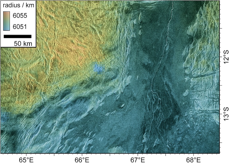 Cracks on Venus: View of terrain from above, with yellowish and purplish regions and long, winding cracks.