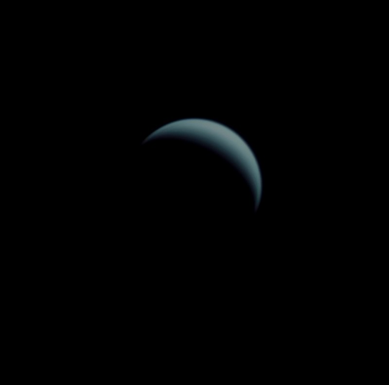 A thin blue crescent pointing upward.