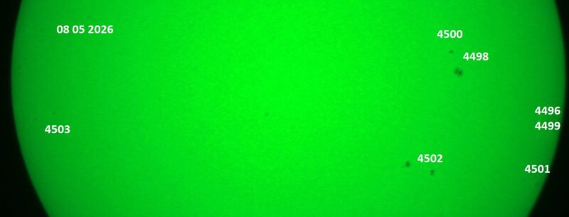 The sun, seen as a green sectional sphere with dark spots, each labeled.