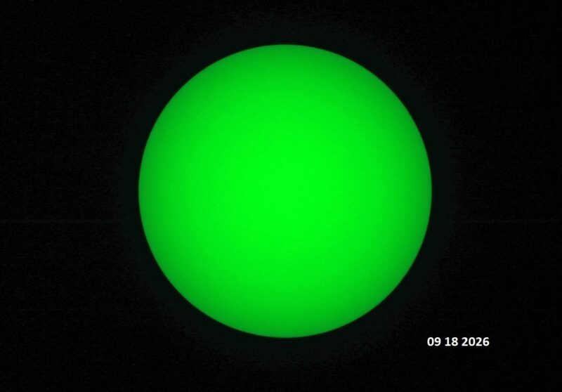 The sun, seen as a green sectional sphere with dark spots, each labeled.