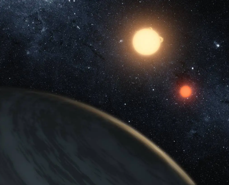 Part of a planet at bottom left and 2 suns at upper right.