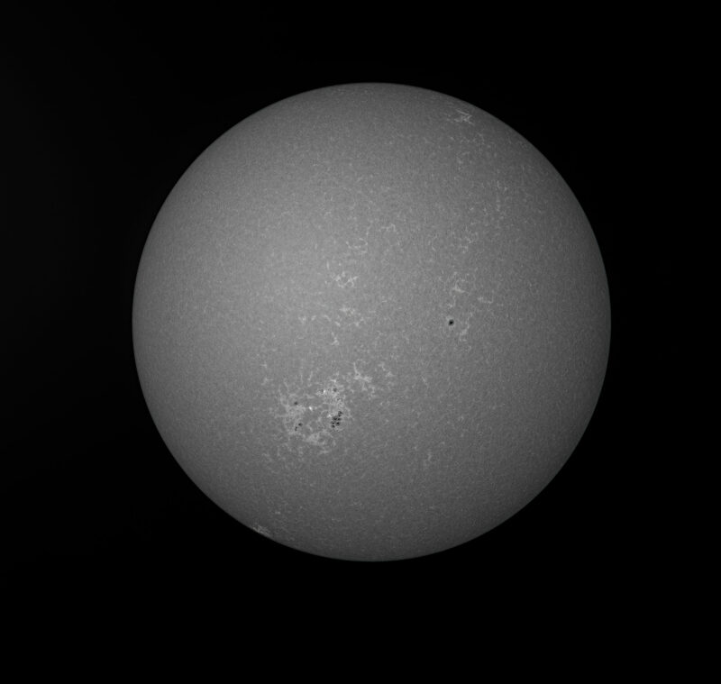 The sun, seen as a large gray sphere.