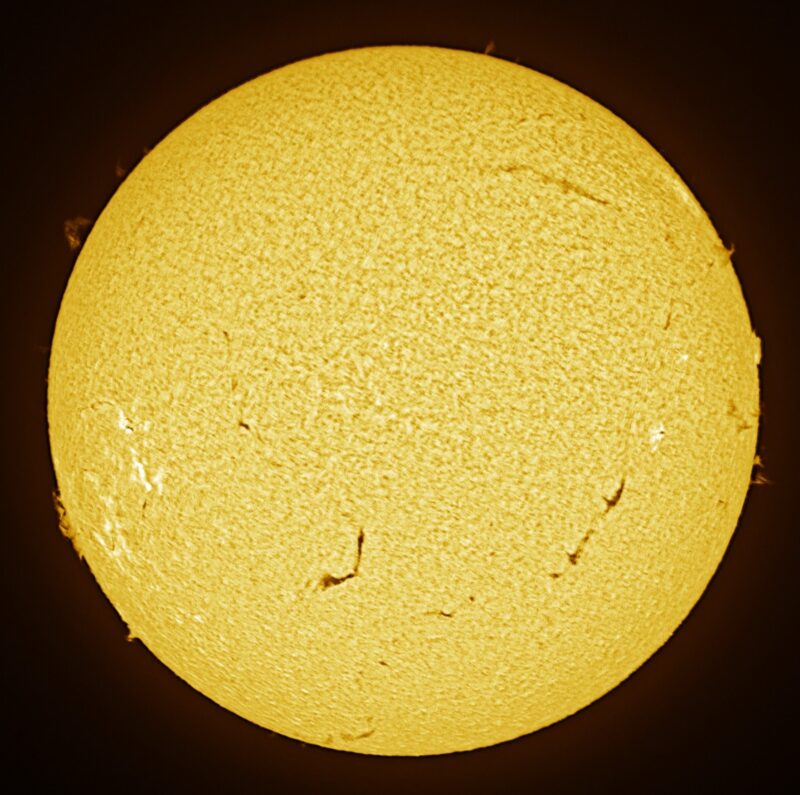 The sun, seen as a large yellow sphere with a mottled surface.
