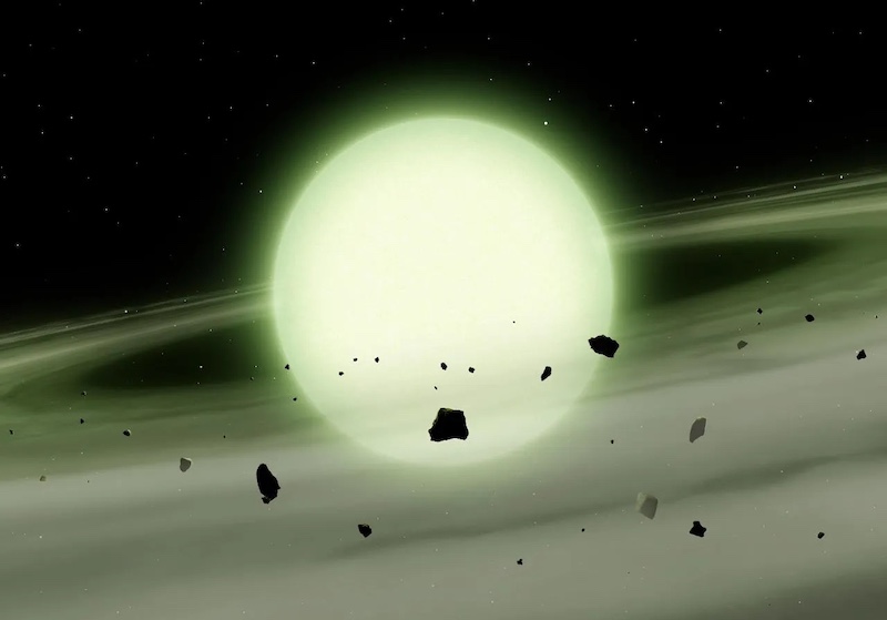 True colors of white dwarf stars: Greenish sphere in space, with rings of dust and small bits of rocky debris around it.
