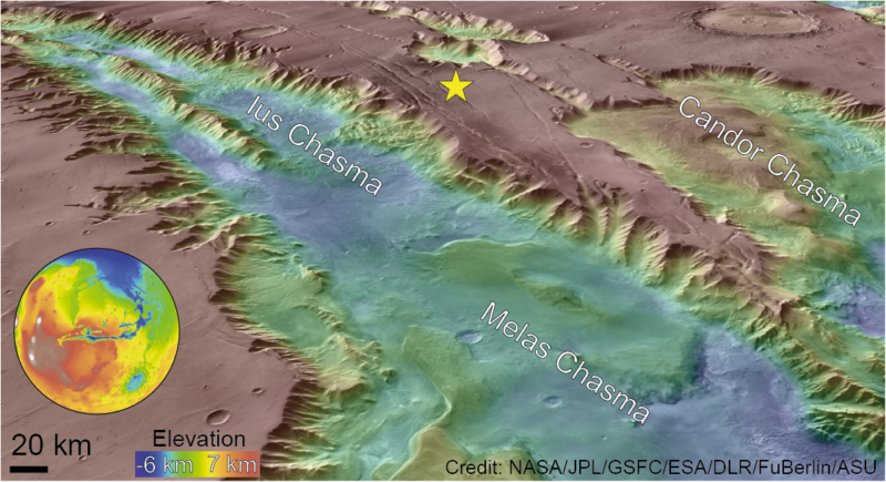 Map of canyon terrain showing lower areas in blue with a yellow star between two chasms.